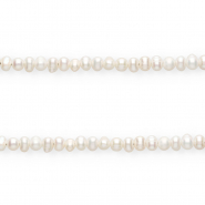 Imperfect freshwater pearls round 5-6mm Ivory