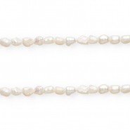 Imperfect freshwater pearls nugget oval 7x5-6mm Natural White