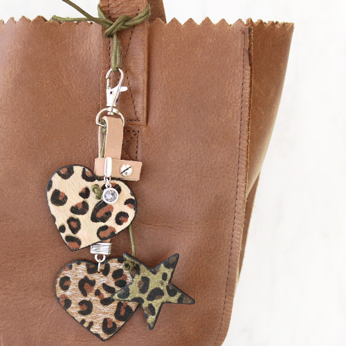 Keychains with pendants faux leather hairy, stainless steel and cheerful tassels