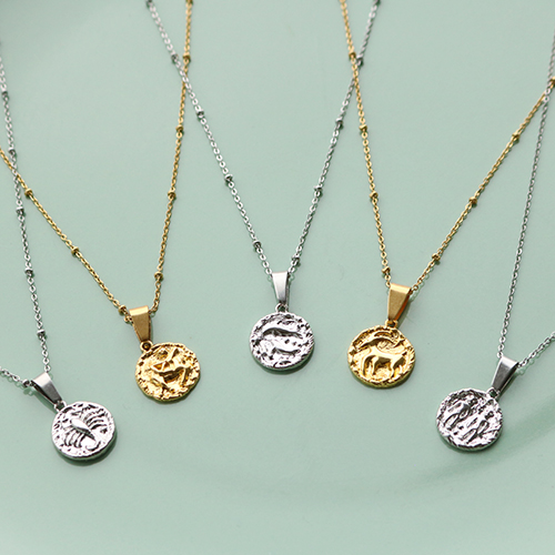 With the new brass TQ horoscope charms you can make these necklaces and earrings: