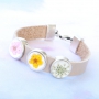 Bracelets and keychains with pendants and cabochons of real flowers and shells