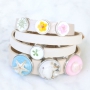 Bracelets and keychains with pendants and cabochons of real flowers and shells