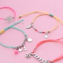 Bracelets of coloured cord with cute summery charms of stainless steel