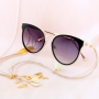 Summer proof: sunglasses cords with golden details and minimalist earrings