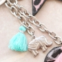 Keychains with pendants faux leather hairy, stainless steel and cheerful tassels