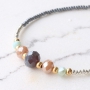 Colourful bracelets of faceted beads with golden details