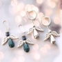 Angels with top faceted drop shaped beads and metal wings