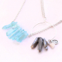 Earrings and necklaces with drop shaped natural stone beads and aura quartz crystal