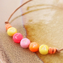 Cheerful jewellery with letter beads, fimo charms, wooden beads and Katsuki beads
