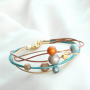 Amazing earrings and bracelets in warm colours made of new Polaris Elements beads