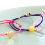 Need some inspiration? It's easy to make trendy bracelets out of elastic cord: