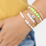 These cool summer bracelets can be made with letter beads and zodiac beads: 