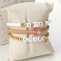 These cool summer bracelets can be made with letter beads and zodiac beads: 