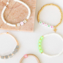 These cool summer bracelets can be made with letter beads and zodiac beads: 