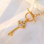 Design earrings and necklaces with key charms