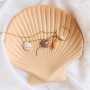 Get creative with large shell pendants