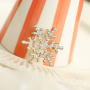 Mix & Match: Create your own festive look with pins and brooches