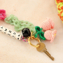 Create trendy keychains with crocheted and resin pendants