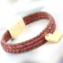 Fashionably bracelets made of waxed cord with different items of Designer Quality metal