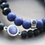 Stylish jewellery with acrylic beads and diverse stringing materials in dark tones like blue and anthracite. 