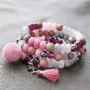 Trendy jewellery made of facet cut natural stone beads in pink and grey shades